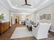 Inviting living room featuring coffered ceilings, wood floors, and ample natural light at 14325 Stirling Dr, Lakewood Ranch, FL 34202