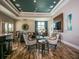 Spacious and well-lit living room featuring modern decor, a large TV, and comfortable seating for relaxing and entertaining at 14325 Stirling Dr, Lakewood Ranch, FL 34202