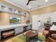 Versatile office space open to a dining area with built-in cabinets, a ceiling fan, and neutral decor at 14325 Stirling Dr, Lakewood Ranch, FL 34202