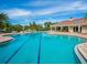 Community pool area with lap lanes, lounge chairs, and a covered pavilion for relaxing poolside at 14325 Stirling Dr, Lakewood Ranch, FL 34202