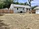 Quaint home featuring a wooden deck and fenced backyard with an air conditioning unit at 1512 18Th W Ave, Bradenton, FL 34205
