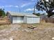 The backyard features a shed, deck, mature tree and lawn for outdoor enjoyment at 1512 18Th W Ave, Bradenton, FL 34205