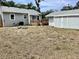 A backyard with a shed and deck, offering plenty of potential for outdoor activities and storage at 1512 18Th W Ave, Bradenton, FL 34205
