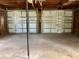 Spacious garage with a two-car capacity and white paneled doors with gray frames at 1512 18Th W Ave, Bradenton, FL 34205