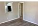 Inviting living space featuring durable floors with a kitchen view and an open doorway at 1512 18Th W Ave, Bradenton, FL 34205