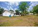 Expansive backyard with mature trees, perfect for outdoor activities and relaxation at 15718 Squirrel Tree Pl, Tampa, FL 33624