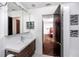 Modern bathroom with tiled walls, and a wood vanity cabinet at 15718 Squirrel Tree Pl, Tampa, FL 33624