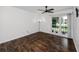 Bright bedroom with hardwood floors and large sliding glass doors at 15718 Squirrel Tree Pl, Tampa, FL 33624