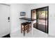 Cozy breakfast bar with seating and sliding glass doors to an outdoor deck at 15718 Squirrel Tree Pl, Tampa, FL 33624