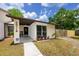 Inviting home entrance with a comfortable porch, and well-maintained landscaping at 15718 Squirrel Tree Pl, Tampa, FL 33624