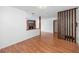 Open-concept living area offering seamless flow, neutral tones, and wood flooring at 15718 Squirrel Tree Pl, Tampa, FL 33624