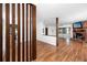 Open concept living area with fireplace, wood floors, and a view to sunroom at 15718 Squirrel Tree Pl, Tampa, FL 33624