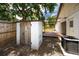 Outdoor shed with backyard deck and patio, perfect for storage and leisure at 15718 Squirrel Tree Pl, Tampa, FL 33624