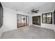 Relaxing sunroom with tile flooring and large windows, perfect for enjoying the view at 15718 Squirrel Tree Pl, Tampa, FL 33624