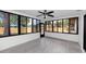 Bright sunroom with tile floor and numerous windows, offering views of the outdoors at 15718 Squirrel Tree Pl, Tampa, FL 33624