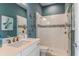 Bright bathroom with white tiled shower, glass door, quartz counters and copper fixtures at 16404 Isola Pl, Bradenton, FL 34211