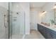 Modern bathroom features a glass shower, a double vanity, and stylish fixtures at 16404 Isola Pl, Bradenton, FL 34211