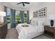 Cozy bedroom with a bay window, decorative curtains, and a tray on the bed at 16404 Isola Pl, Bradenton, FL 34211