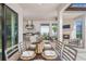 Elegant outdoor dining area with grill, fireplace, and comfortable seating at 16404 Isola Pl, Bradenton, FL 34211