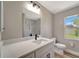 Stylish bathroom featuring modern fixtures, vanity, and a window for natural light at 168 Wading Bird Dr, Venice, FL 34292