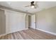 Spacious bedroom with a ceiling fan, closet, and door to another room at 168 Wading Bird Dr, Venice, FL 34292