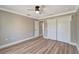Well-designed bedroom with wood-look flooring and closet at 168 Wading Bird Dr, Venice, FL 34292