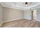 A bright bedroom features hardwood floors and access to ensuite at 168 Wading Bird Dr, Venice, FL 34292