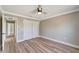 Comfortable bedroom featuring a ceiling fan, neutral walls, and a closet for ample storage at 168 Wading Bird Dr, Venice, FL 34292