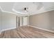 A bright bedroom features hardwood floors, with access to ensuite bath at 168 Wading Bird Dr, Venice, FL 34292