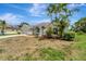 Charming single-story home with well-manicured lawn and tropical landscaping, perfect for Florida living at 168 Wading Bird Dr, Venice, FL 34292