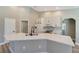 Bright kitchen featuring white cabinetry, quartz countertops, and stainless appliances at 168 Wading Bird Dr, Venice, FL 34292