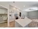 Bright kitchen with white cabinetry, quartz countertops, stainless appliances, and adjacent dining area at 168 Wading Bird Dr, Venice, FL 34292