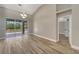 Open living space with tile floors and sliding doors overlooking the pool at 168 Wading Bird Dr, Venice, FL 34292