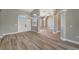 Open floorplan living area with double front doors, views, and modern lighting at 168 Wading Bird Dr, Venice, FL 34292