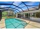 The enclosed outdoor pool has steps that offer a perfect blend of fun, privacy, and relaxation at 168 Wading Bird Dr, Venice, FL 34292