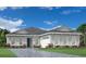 A charming one-story home featuring a three car garage, well manicured yard, and ample windows at 17719 Palmiste Dr, Bradenton, FL 34202