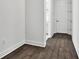 Hallway with a view of a doorway with hardwood floors and light walls at 17719 Palmiste Dr, Bradenton, FL 34202