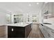 Open concept kitchen with a large island, stainless steel appliances, and plenty of natural light at 17719 Palmiste Dr, Bradenton, FL 34202