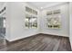 Inviting living room boasting abundant natural light from the oversized windows and hardwood floors at 17719 Palmiste Dr, Bradenton, FL 34202