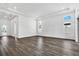 Spacious living room with hardwood floors, recessed lighting, and multiple windows for ample light at 17719 Palmiste Dr, Bradenton, FL 34202