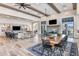 Spacious living room with high ceilings, exposed beams, modern lighting, and stylish furnishings at 17719 Palmiste Dr, Bradenton, FL 34202
