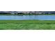 Backyard with lake view and grass at 17811 Roost Pl, Bradenton, FL 34211