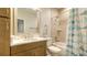 Bathroom featuring a vanity, toilet, and a shower with a shark curtain at 17811 Roost Pl, Bradenton, FL 34211