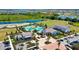 An aerial view showcasing the resort-style community pool, surrounding amenities, and beautifully landscaped grounds at 17811 Roost Pl, Bradenton, FL 34211
