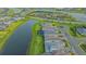 Exterior aerial view of the rear of a luxury home situated on a waterfront lot at 17811 Roost Pl, Bradenton, FL 34211