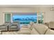 Inviting living room with comfortable seating and views of the lake at 17811 Roost Pl, Bradenton, FL 34211