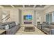 Living room with a decorative fireplace and TV, offering an inviting and modern living space at 17811 Roost Pl, Bradenton, FL 34211