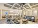 Spacious open-concept living space blending the kitchen, dining area and living room with a fireplace at 17811 Roost Pl, Bradenton, FL 34211