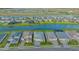 Gorgeous aerial view highlighting the neighborhood, lake, and proximity of homes to one another at 17811 Roost Pl, Bradenton, FL 34211