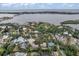 Scenic aerial shot showcasing waterfront property with canal access and city skyline in the distance at 1809 Buccaneer Ter, Sarasota, FL 34231